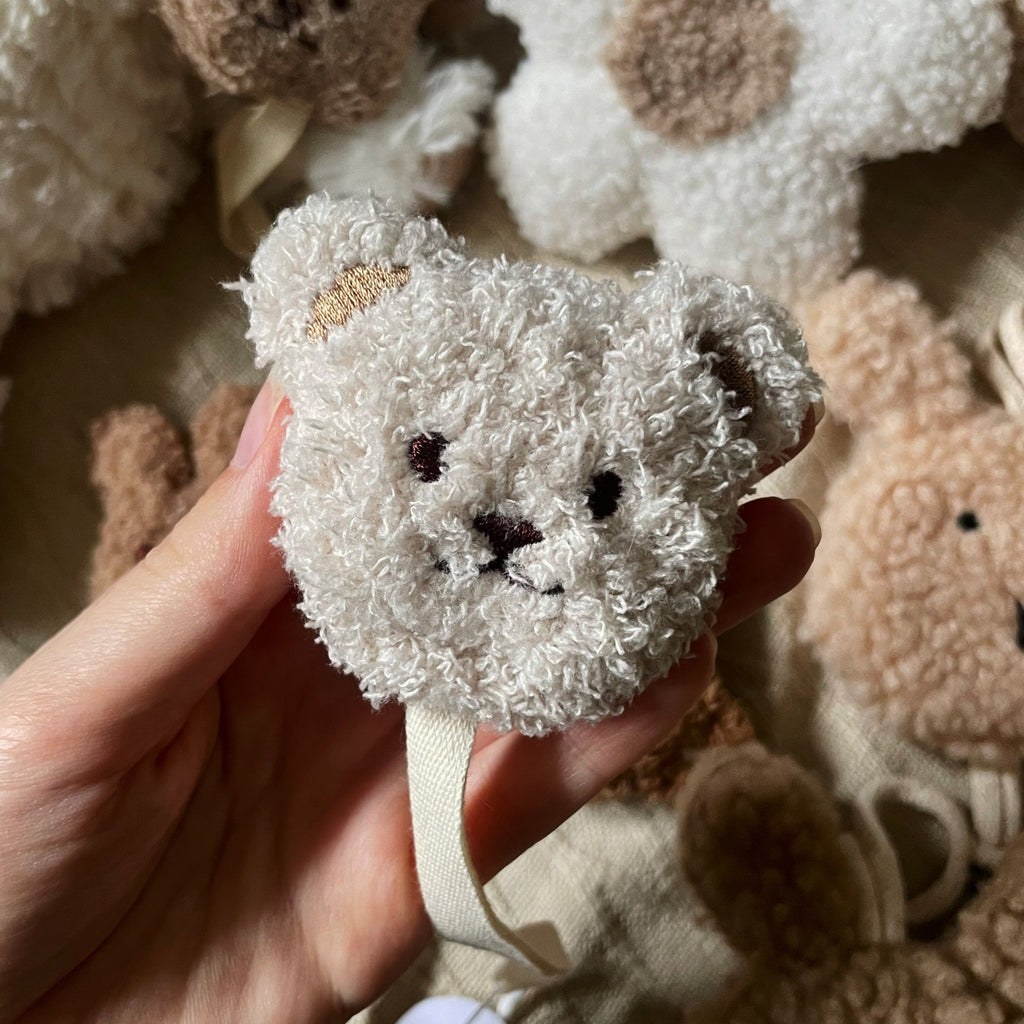 doudou attache-tétine en forme d'ourson blanc